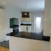 View of open plan kitchen area, kitchen fitted and completed