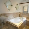 recommended bathroom designers and fitters, ceramic tiles, tiled bath surround - travertine