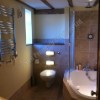 bathroom fitters, travertine tiles, bespoke bath surround tiled