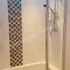 Tiles in shower and bath area on BAL waterproof laytex tanking