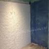 Bathroom fitters, tanked shower under construction showing embossed porcelanosa tiles
